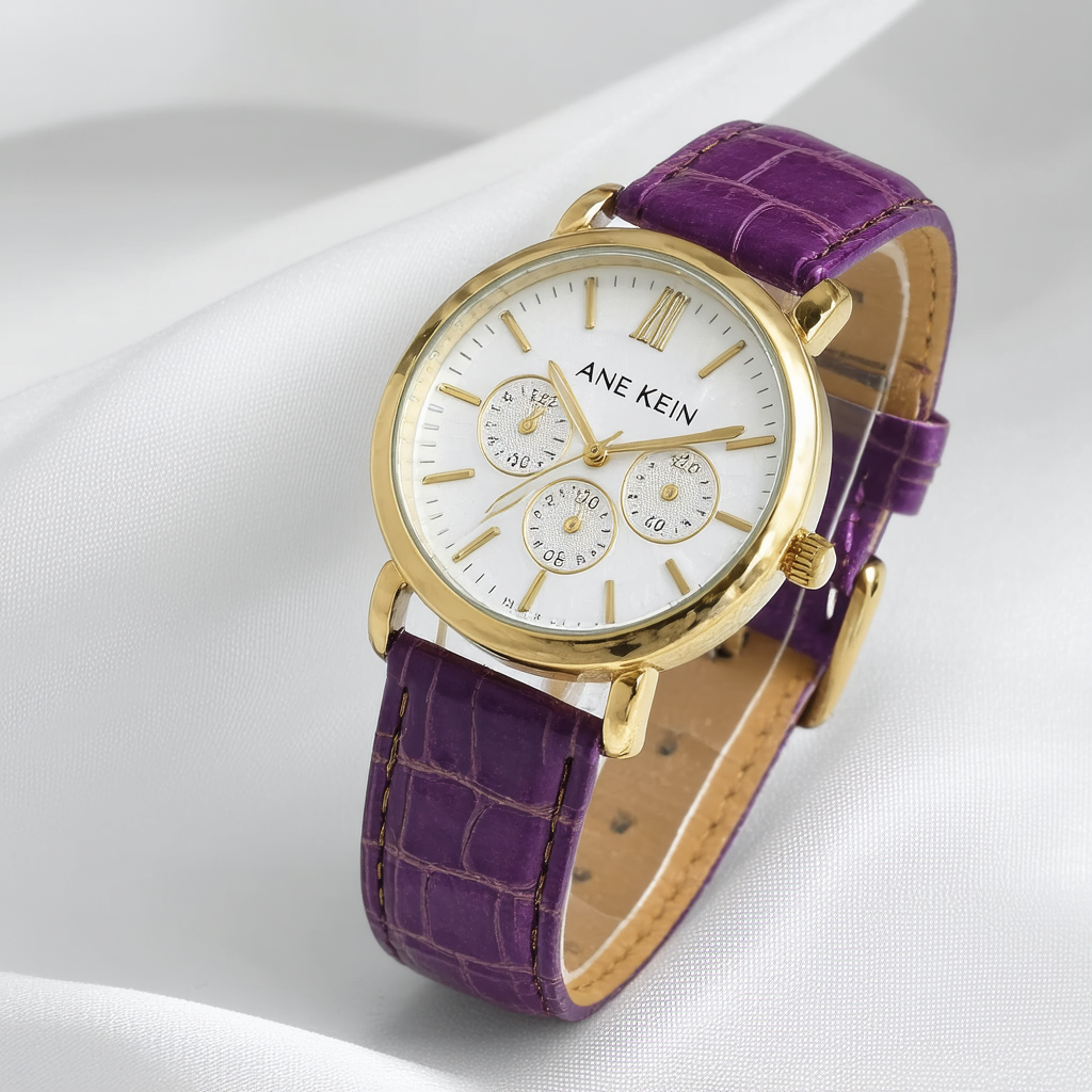 Anne Klein Women's AK/1066PMPR Gold-Tone Purple Leather Strap Watch