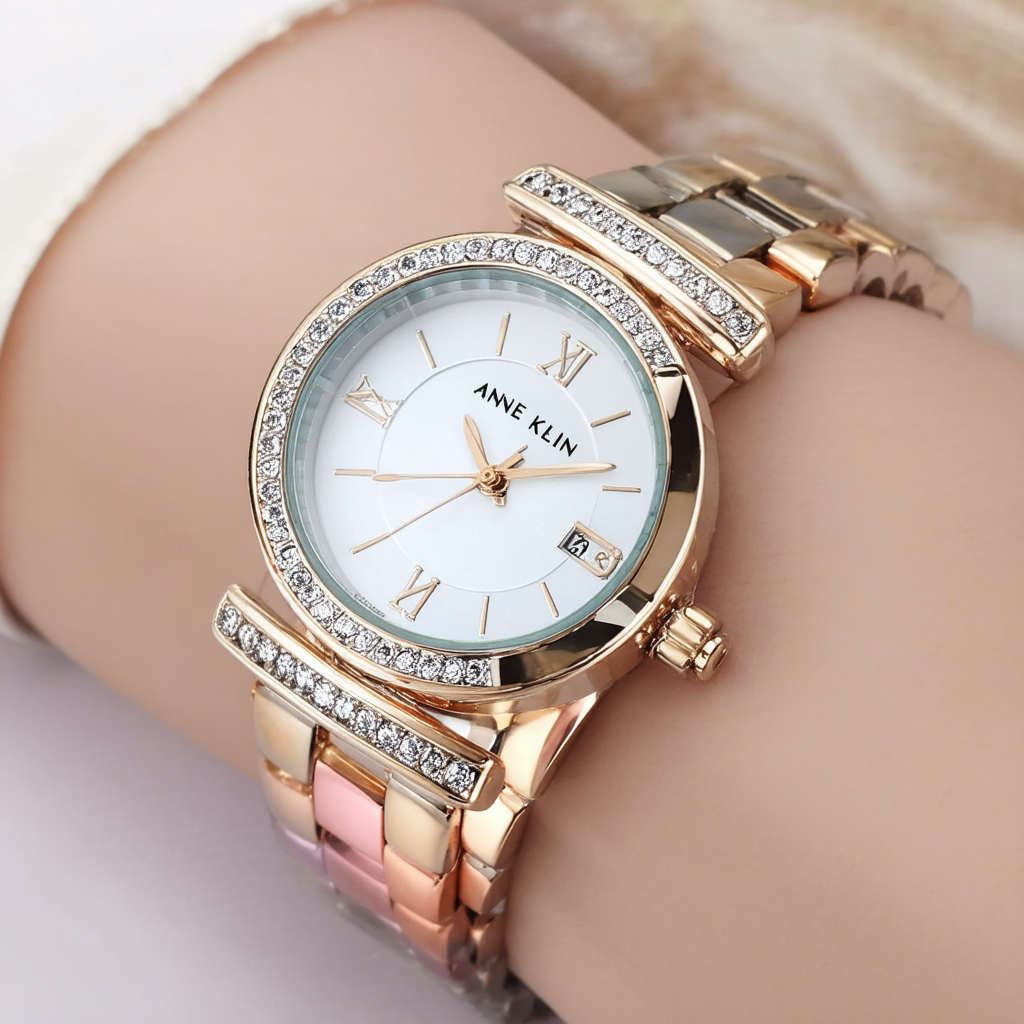 Anne Klein Women's 10/9479SVTR Premium Crystal Accented Tri-Tone Bangle Watch