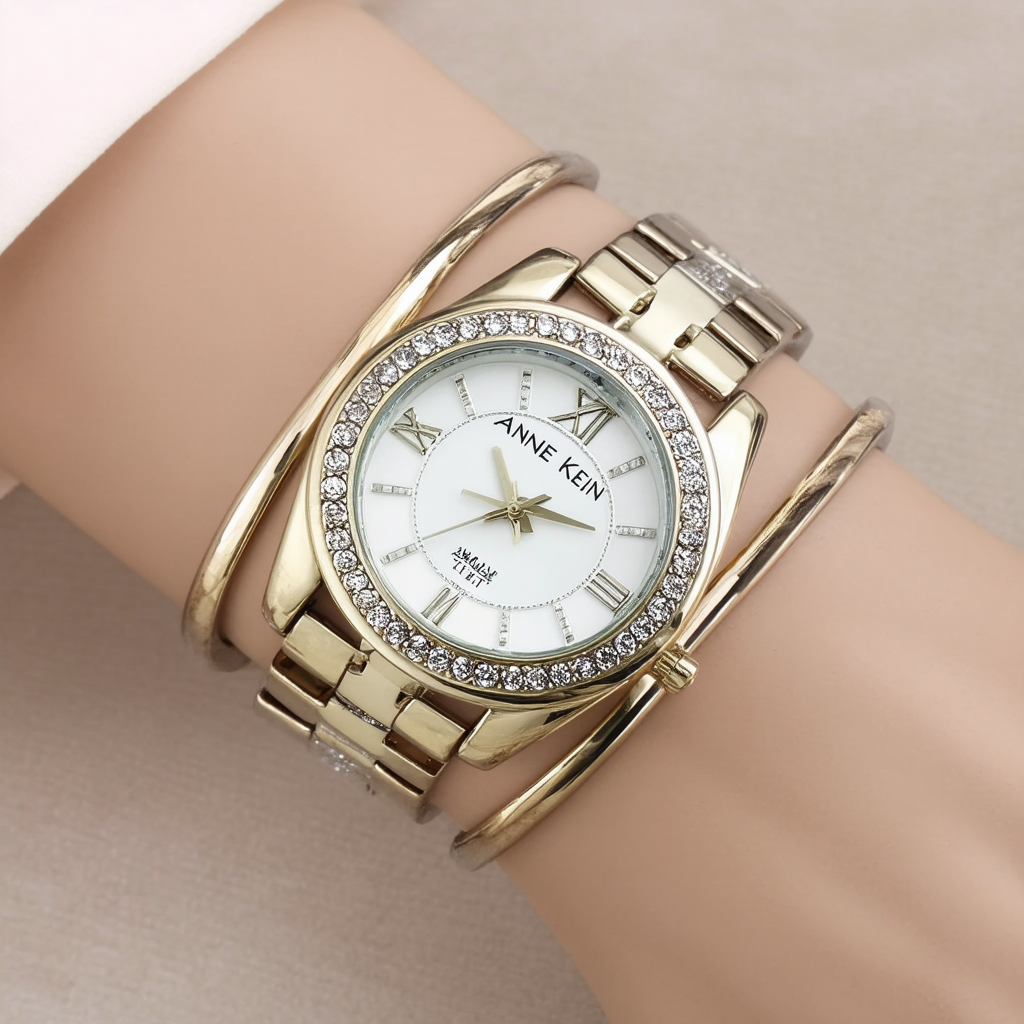 Anne Klein Woman's 109107MPTT Premium Crystal Accented Two-Tone X Shaped Bangle Watch