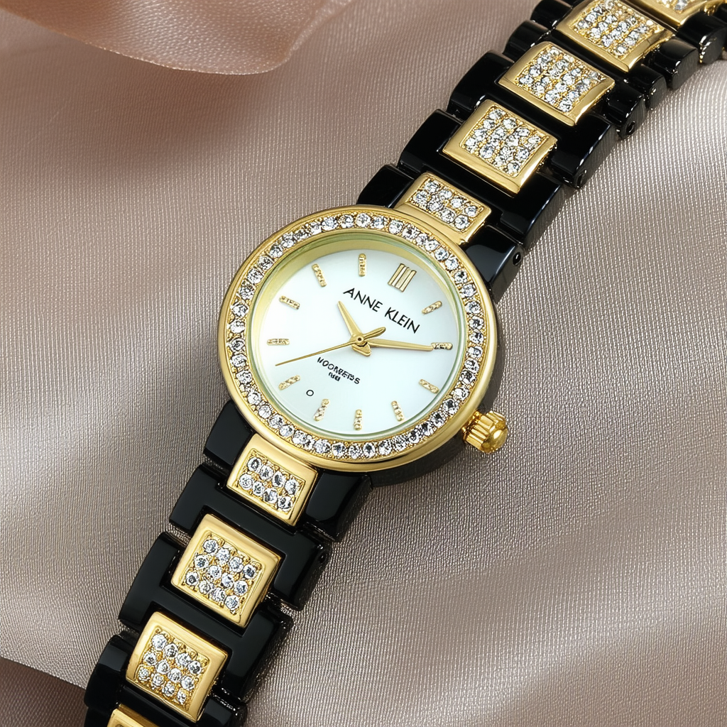 Anne Klein Women's 10/9956BKBK Premium Crystal Accented Gold-Tone Black Resin Bracelet Watch