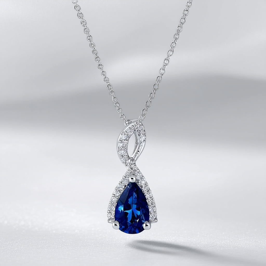 Amazon Collection 10k White Gold Created Blue Sapphire and Diamond-Accent Pear Pendant Necklace, 18"